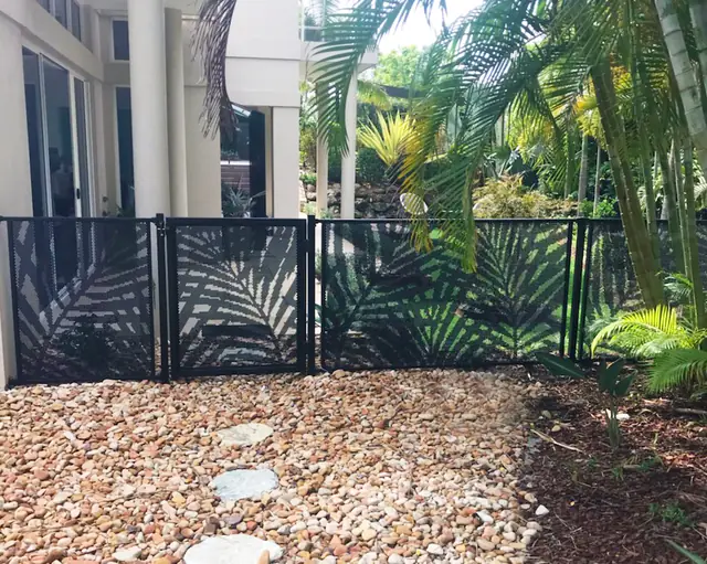 Black Palmy Perf design panels in a tropical garden