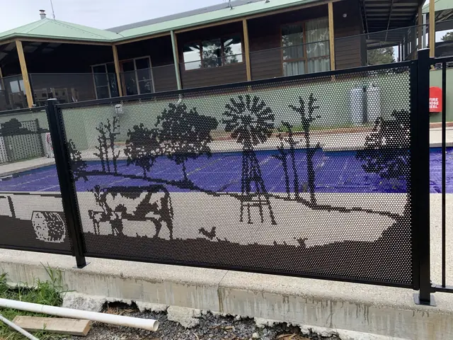 A black one-off custom panel showing a windmill, cows and gum trees