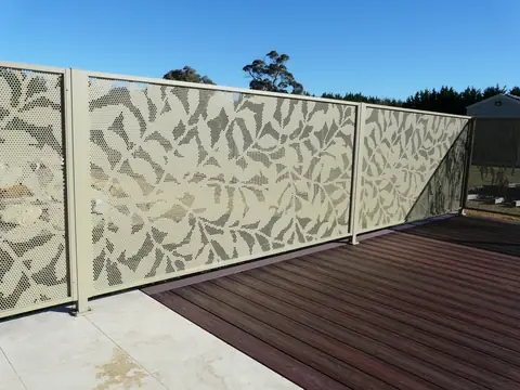 Cream Ficus design panels along the edge of a deck in New South Wales, the leaves dense across each panel