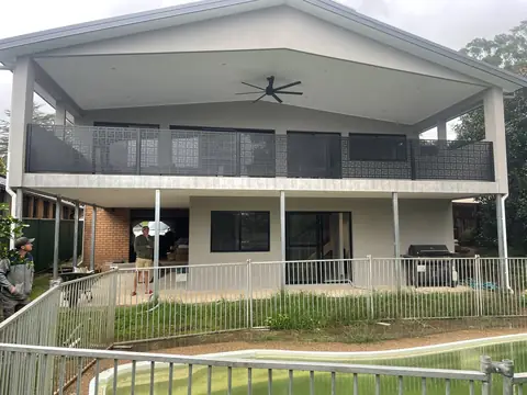 Black Nahosh design balustrade panels along the first floor balcony of a home in New South Wales