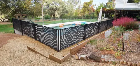 Black Palmy design panels around a Victorian pool, with glass along the far side