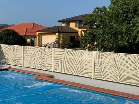 Cream Textured Primrose Palmy design panels along a Queensland pool, the fronds standing out clearly