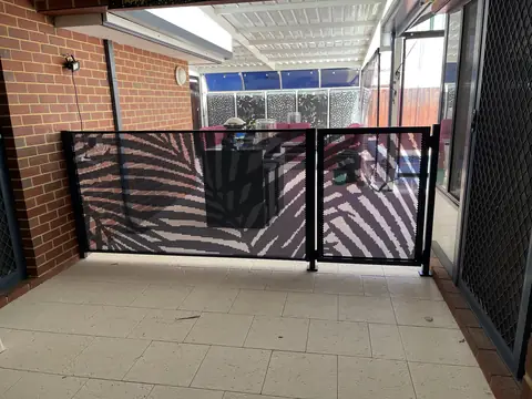 Deep blue Palmy design panels and gate under a patio in Western Australia