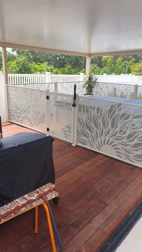 Light coloured Sun Rays design panels on a timber deck beside a pool