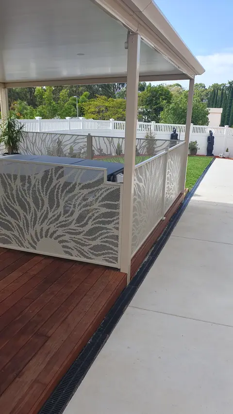 Sun Rays design panels along a covered deck, looking along the fence line