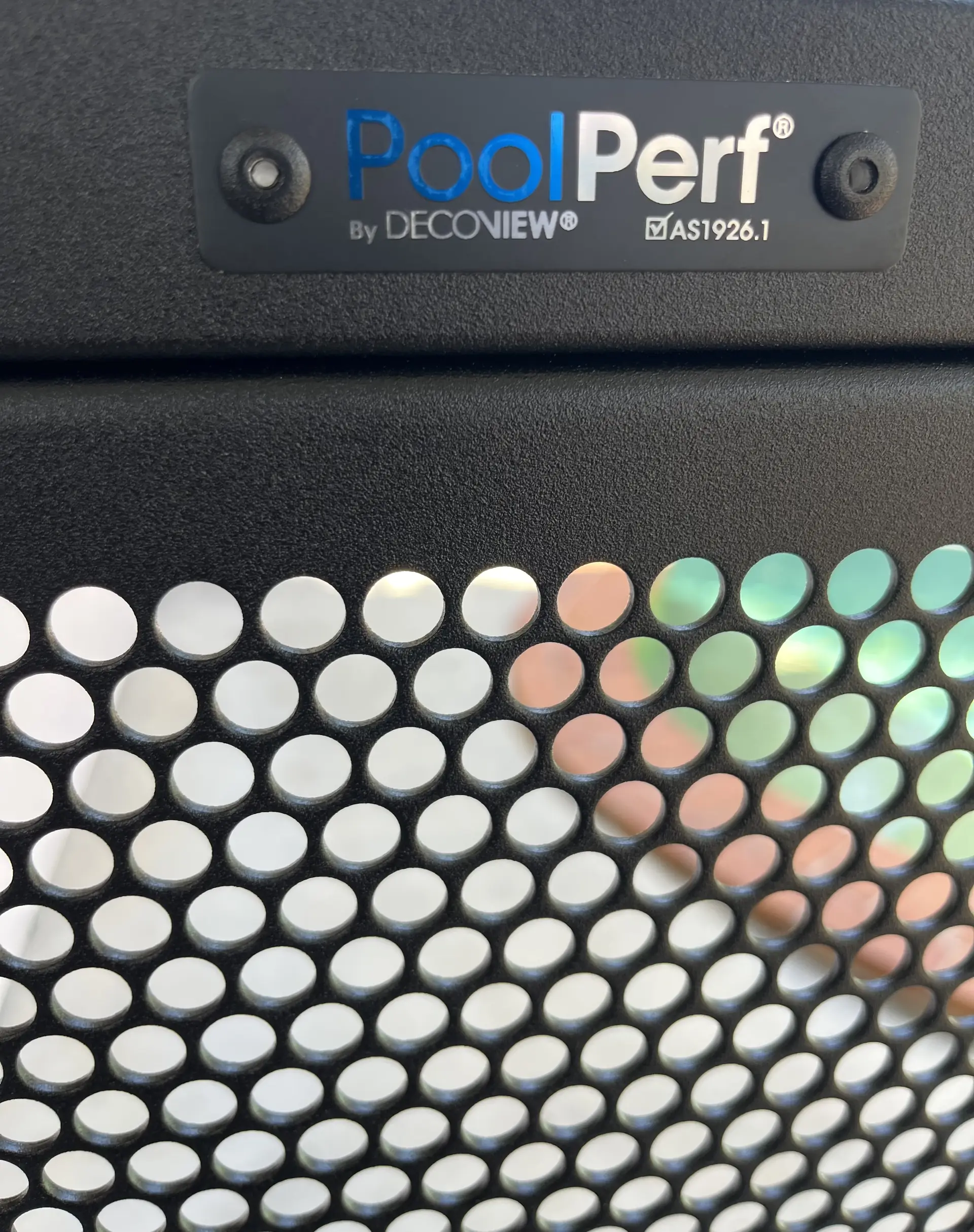 The PoolPerf plate on the top rail of a gate, marked By Decoview and AS1926.1, with the perforated panel below it