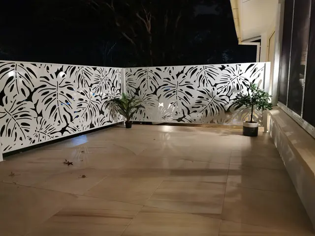 White Monstera 2 design balustrading lit up at night