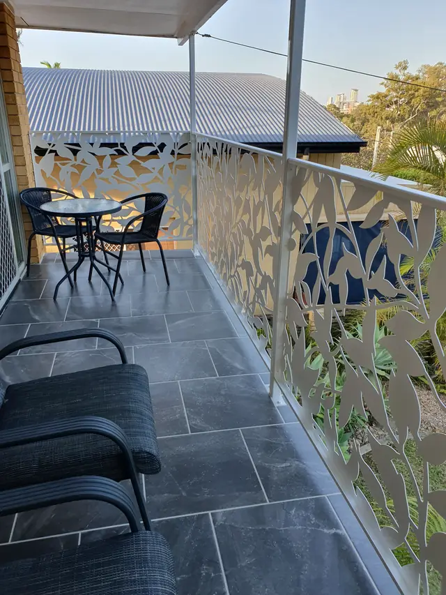 White Ficus design balustrading along a tiled balcony