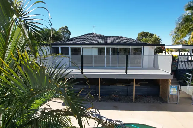 Pale Pure Perf balustrading on a raised deck above a pool