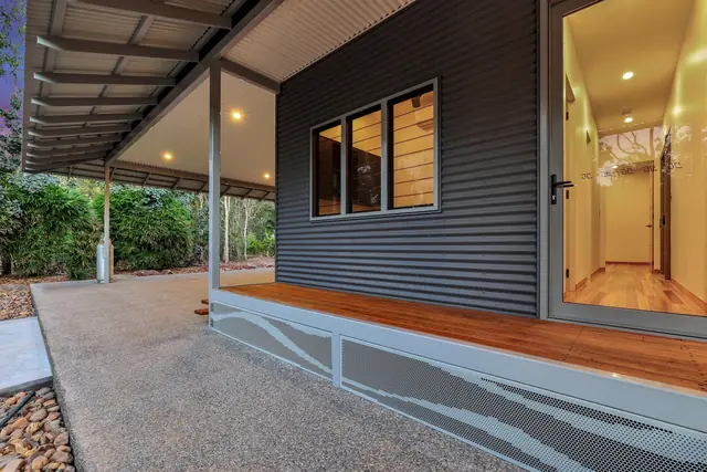 A pale Wave design balustrade along a verandah edge
