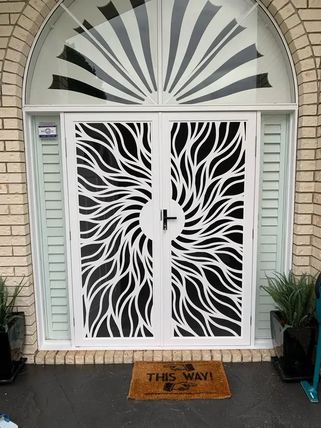 White Sun Rays design security screen doors under an arched window